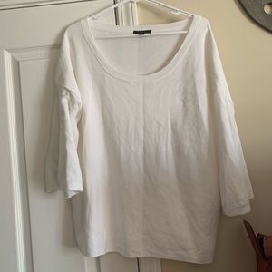 White sweater with bell sleeves and wide neck